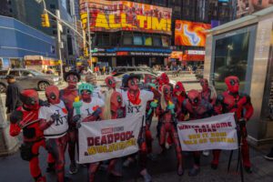 Disney Deadpool Corps Stunt 2024_NYCC_littlecinema_holding signs