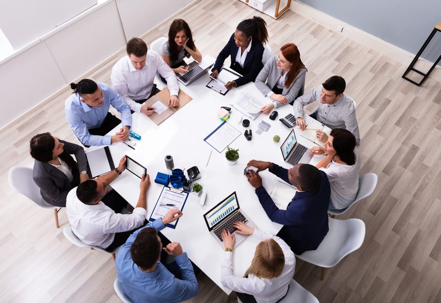 Group Of Multi Ethnic Business Team Sitting Together At Workplace In Modern Office